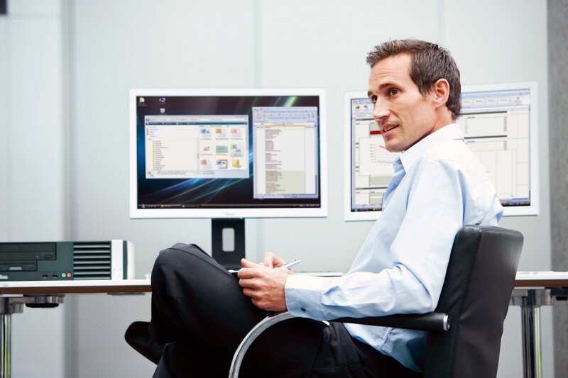 Man working at computer desk