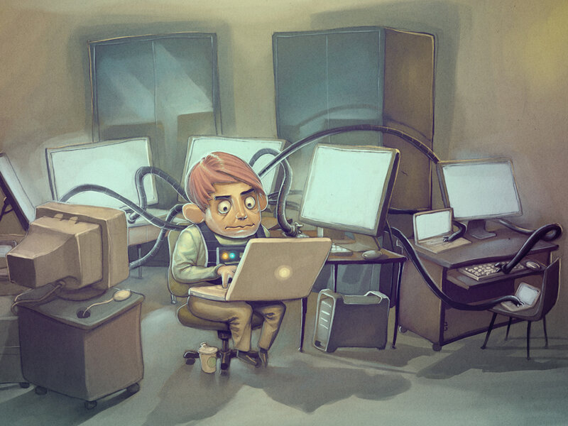 Man working at multiple computers