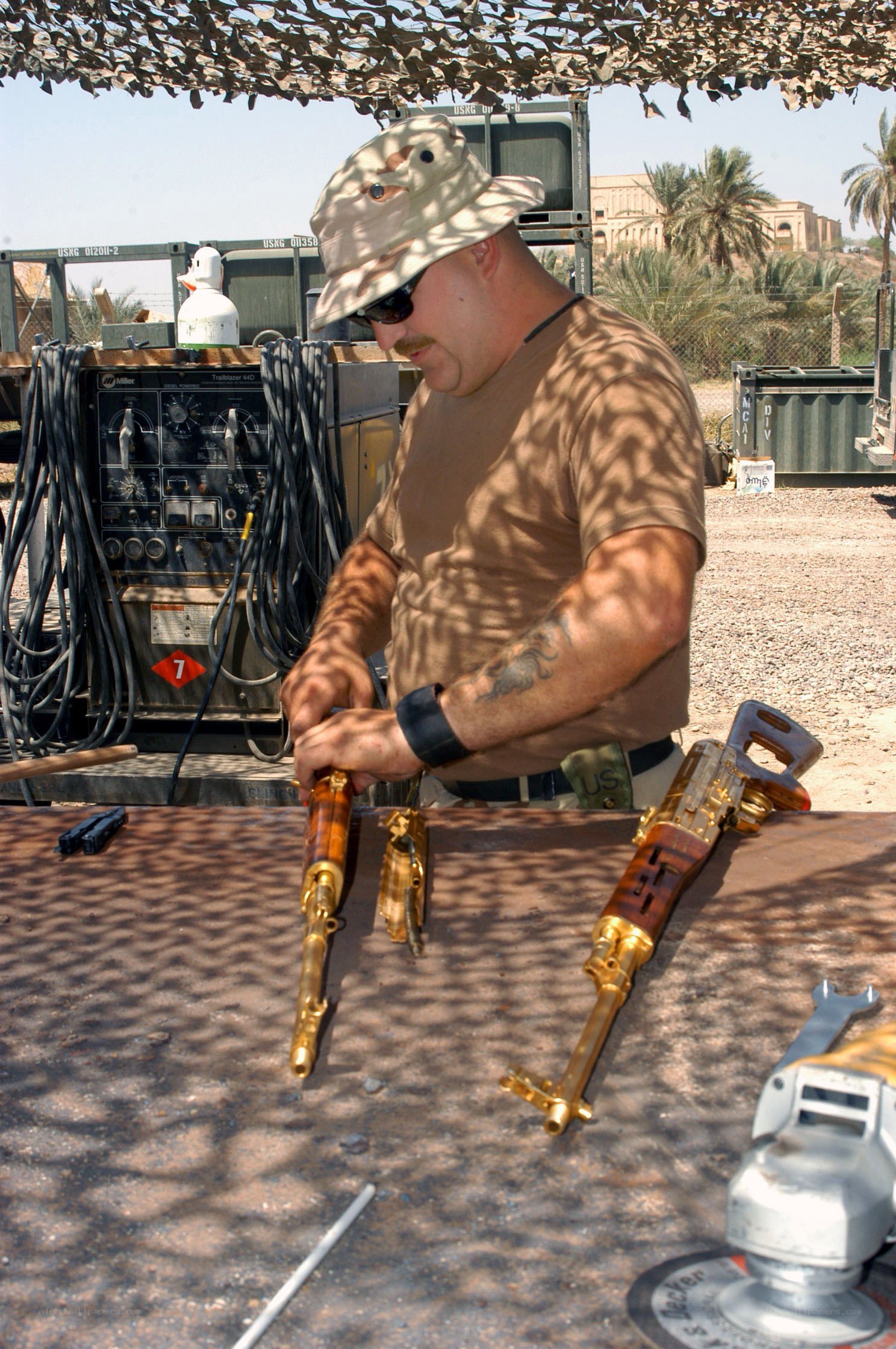 Man working on golden guns