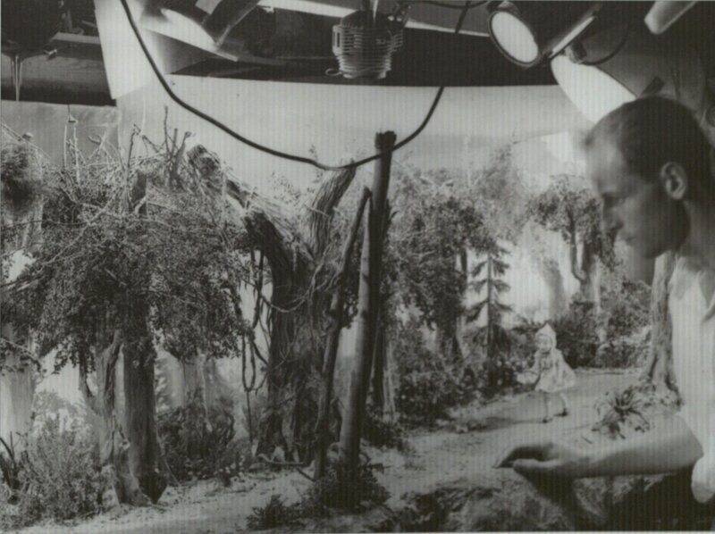 Man Working on Miniature Set