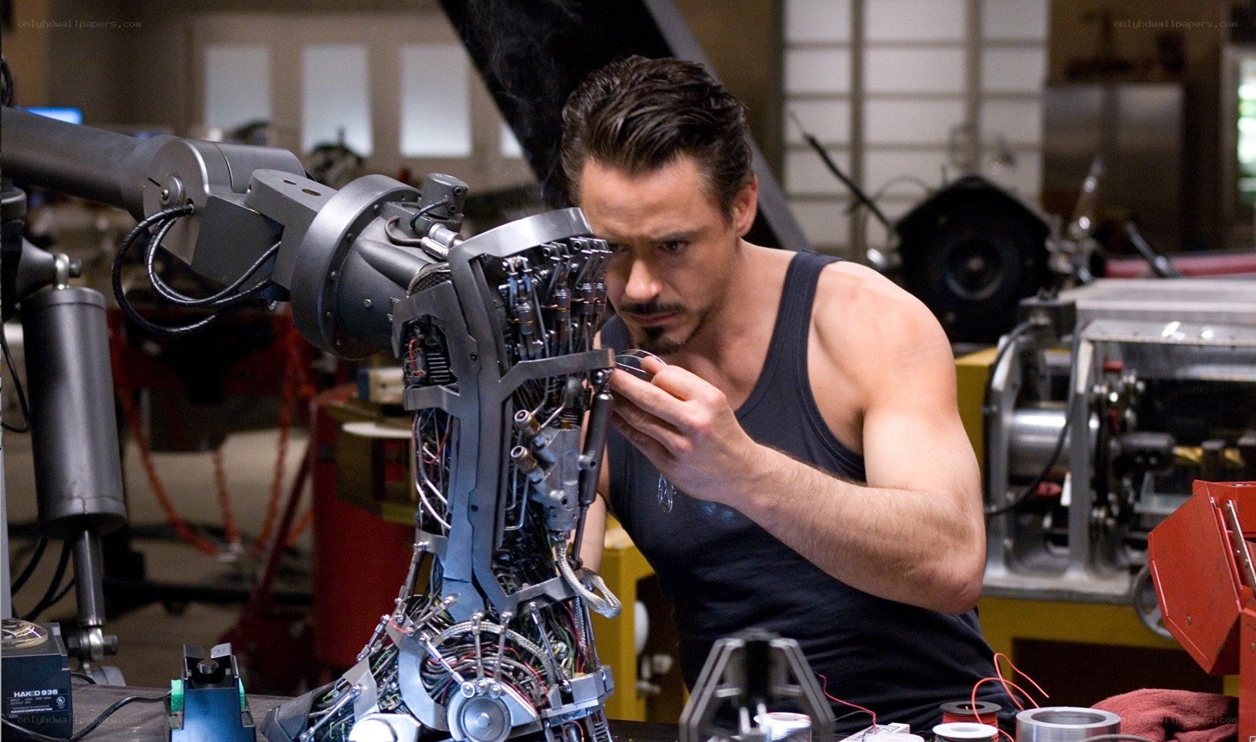 man working on robotic arm