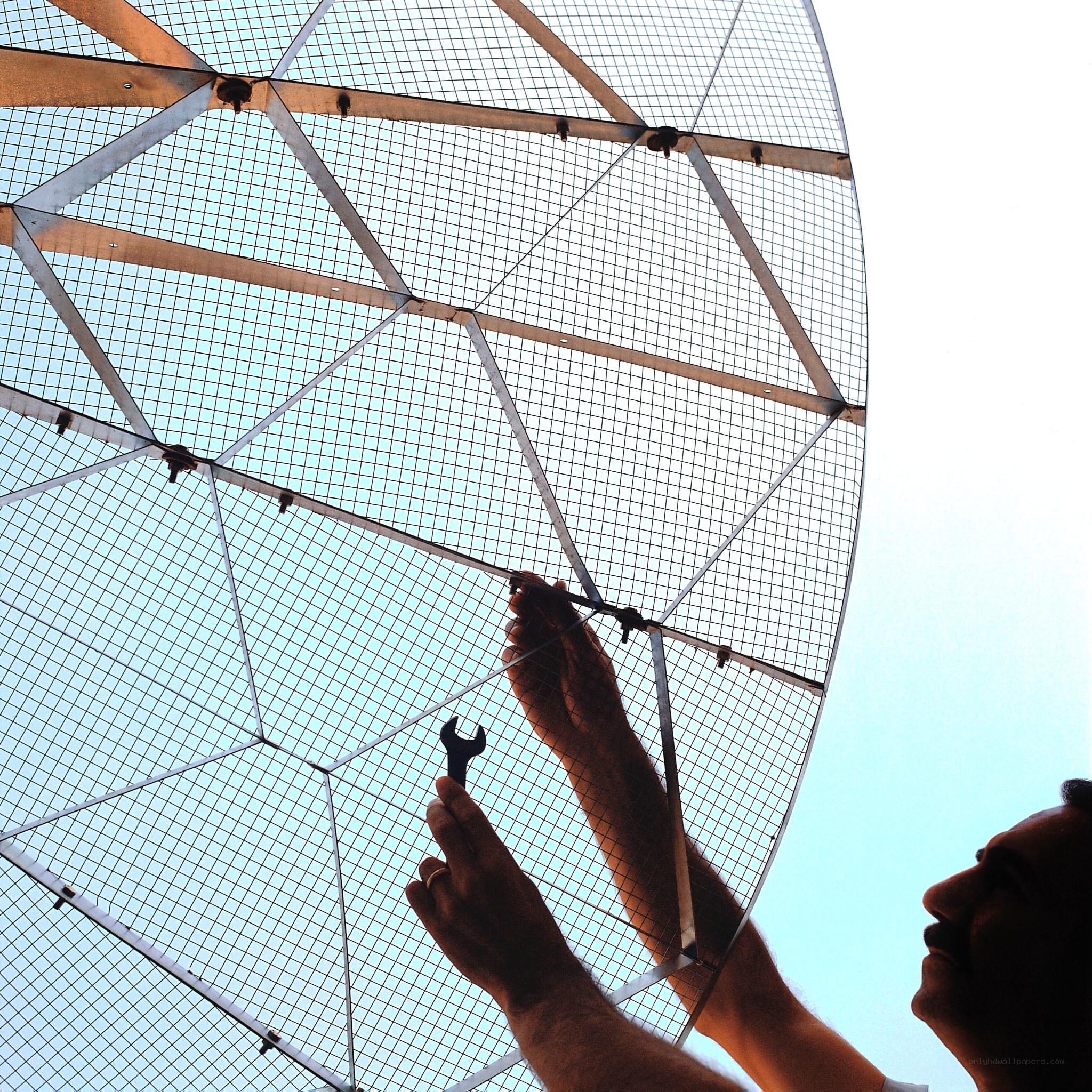 Man working on satellite dish