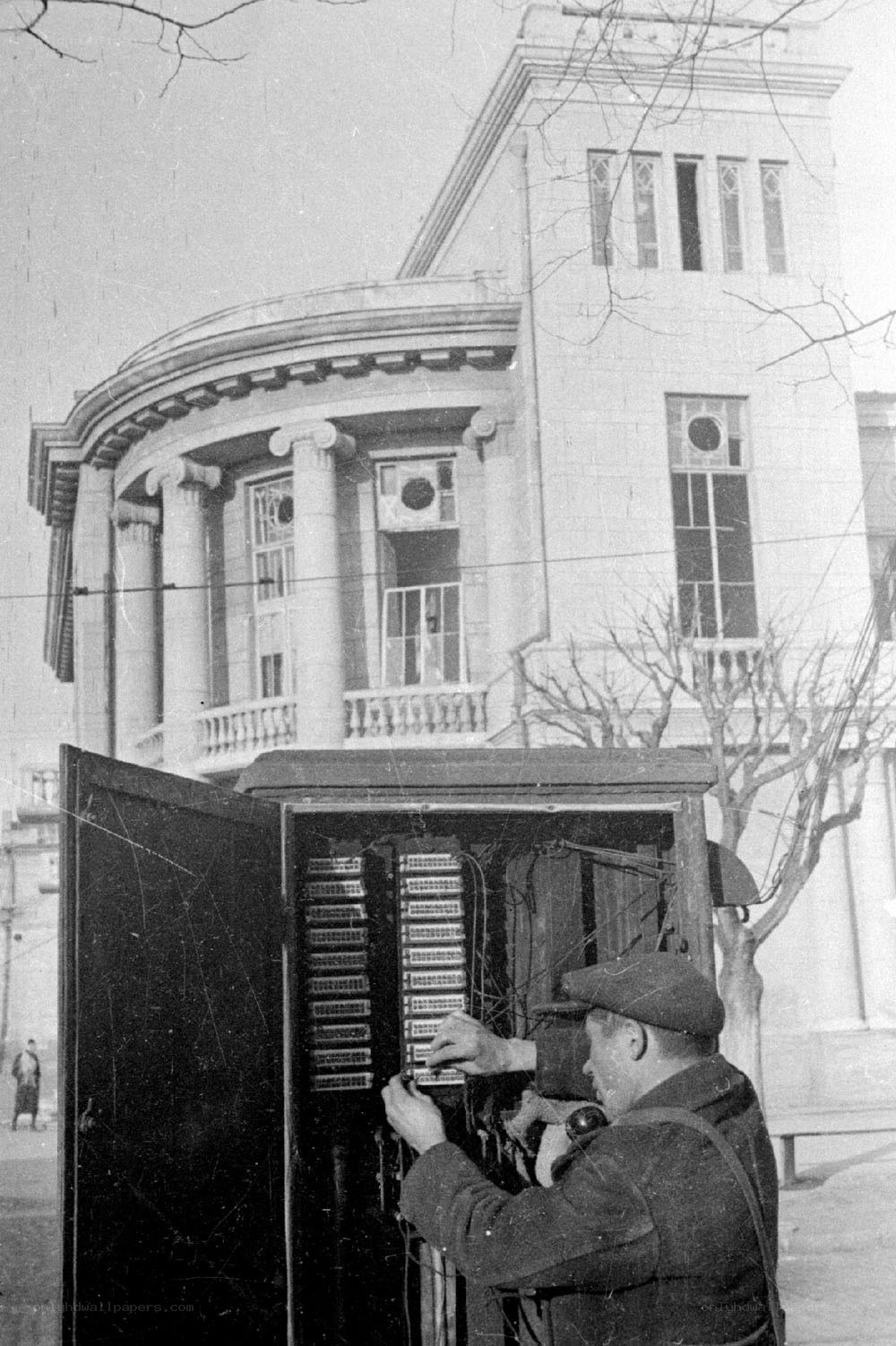 Man working on telephone switchboard