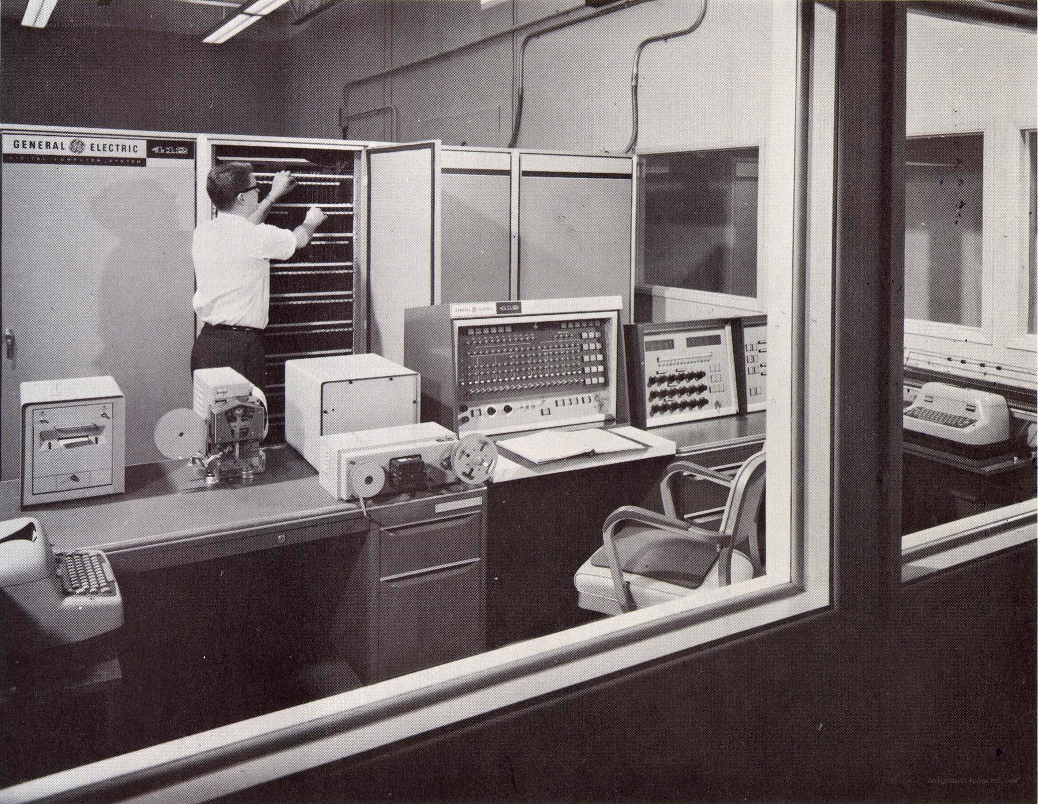 Man working with vintage computer