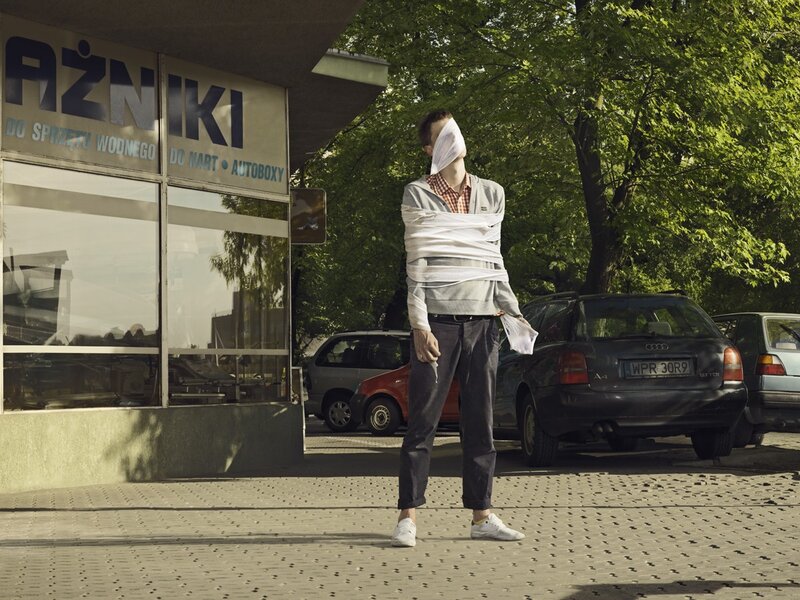 Man wrapped in bandages on street