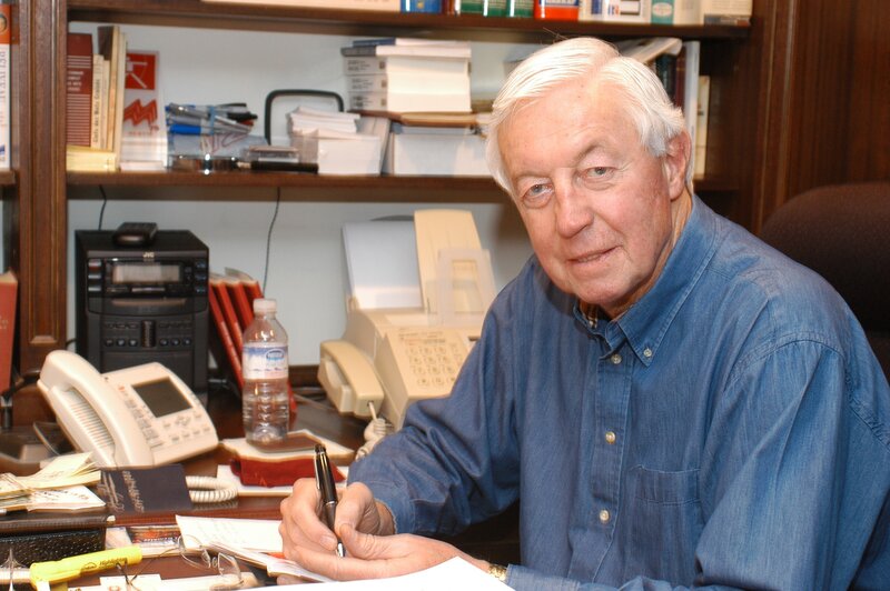 Man writing at a desk