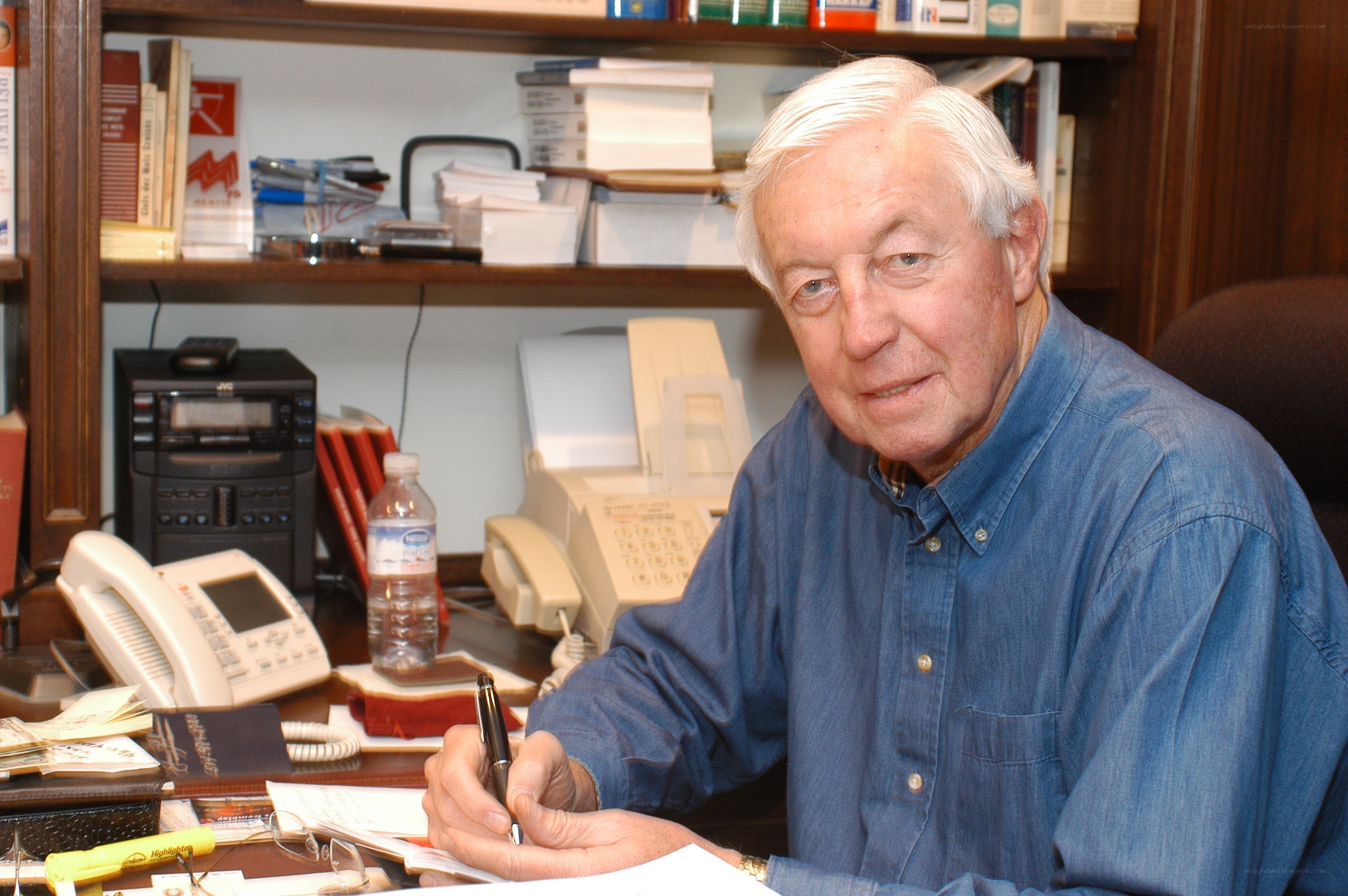 Man writing at a desk