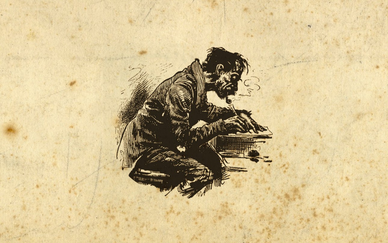 man writing at desk