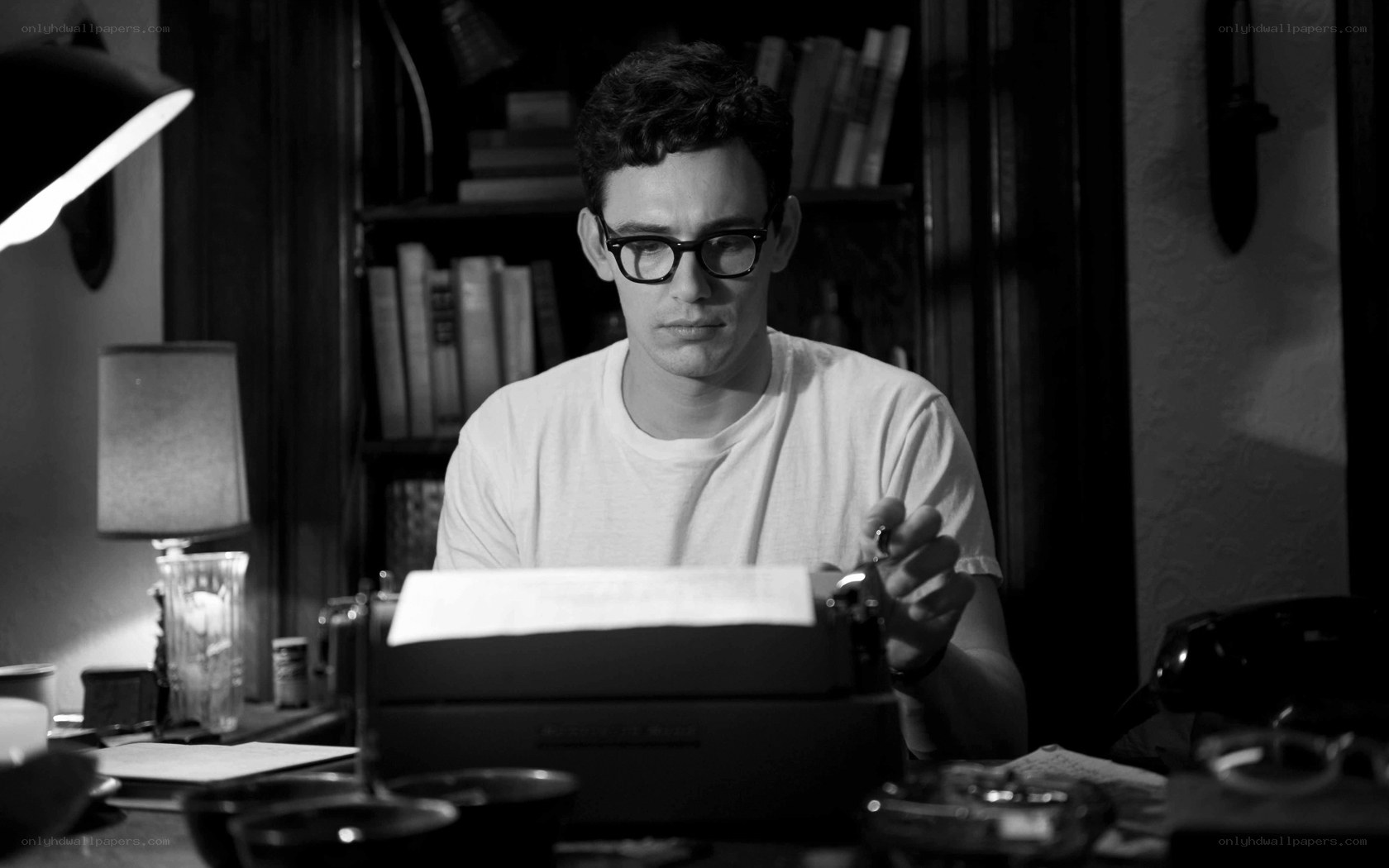 man writing at typewriter