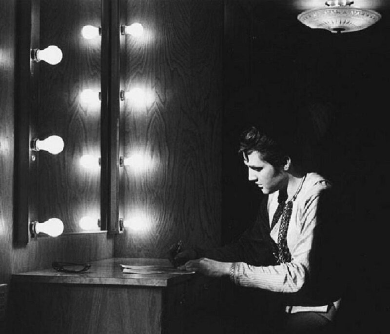 Man Writing at Vanity
