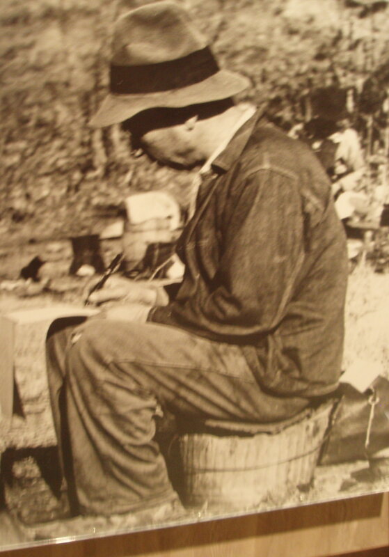 Man writing on a stone