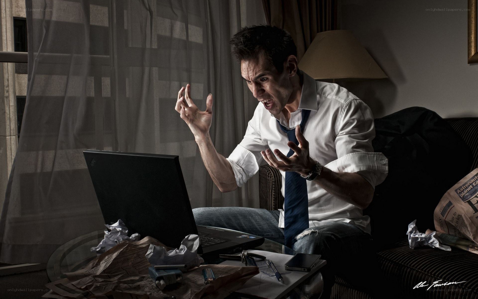 man yelling at laptop