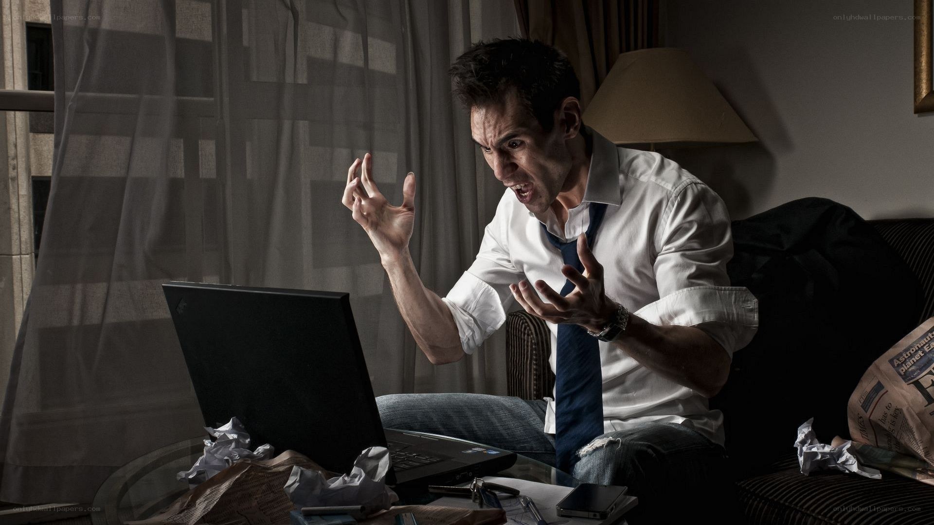 man yelling at laptop