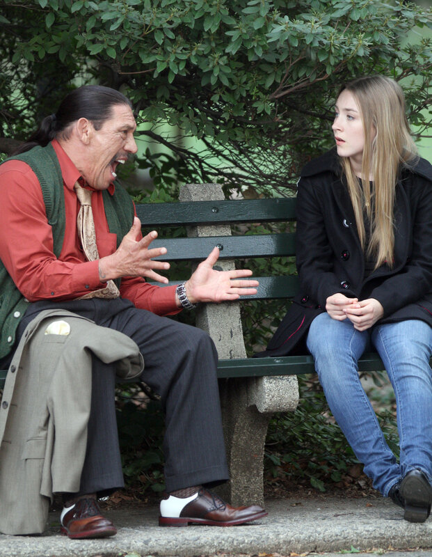 Man yelling at woman on bench