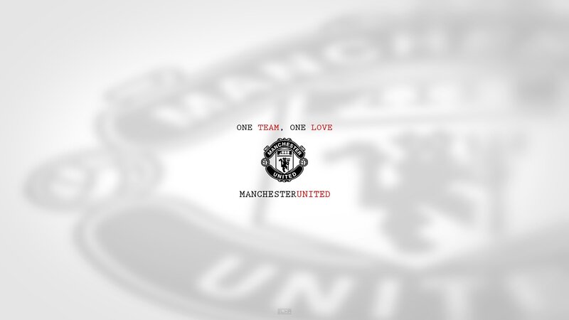 Manchester United logo and slogan
