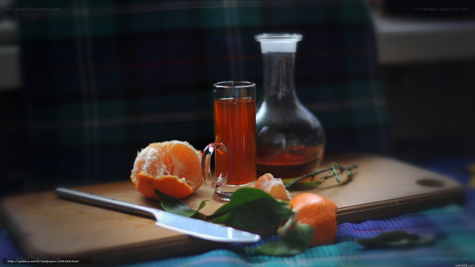 Mandarin and tea on cutting board