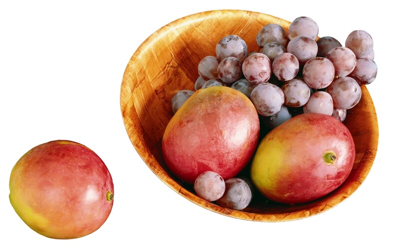 mangoes and grapes in a bowl