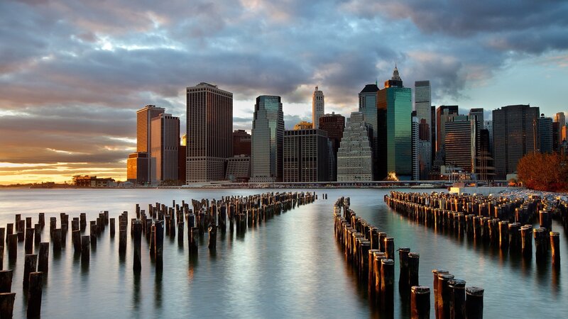 Manhattan Skyline at Sunset — Blue, Dramatic, Photograph, Skyscrapers, Pilings