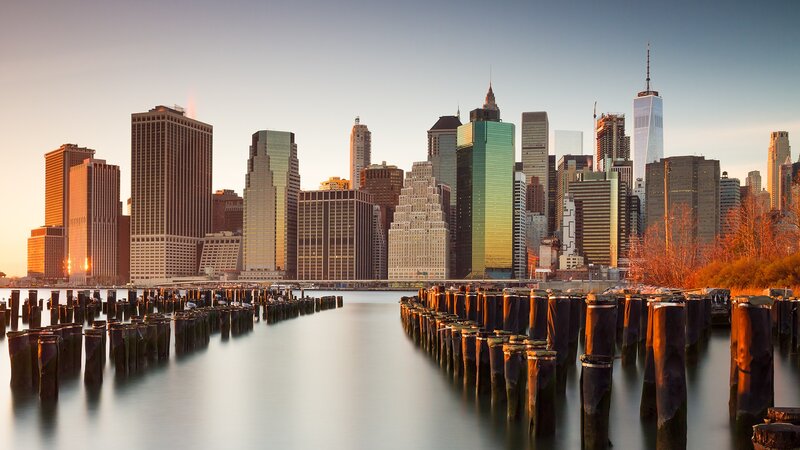 Manhattan Skyline at Sunset — Blue, Serene, Photograph, Skyscrapers, Pilings, River