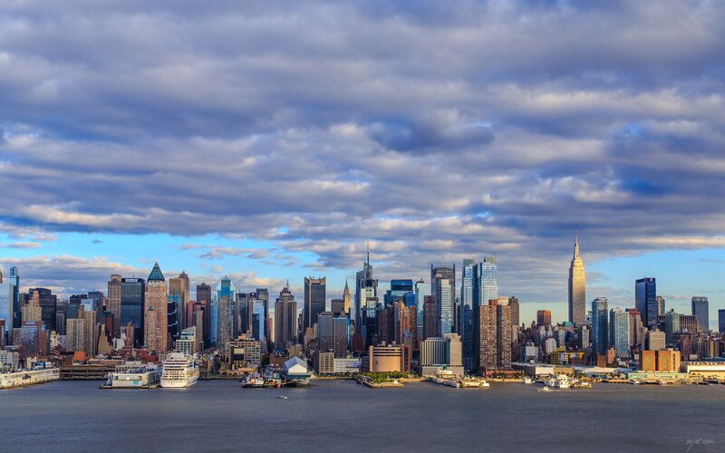 Manhattan Skyline — Blue, Dramatic, Afternoon, Photograph, Skyscrapers, River, Boats