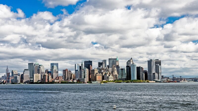 Manhattan Skyline — Blue, Dramatic, Afternoon, Photograph, Skyscrapers, River
