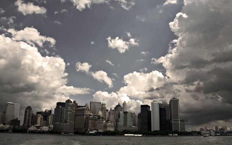 Manhattan skyline under cloudy sky