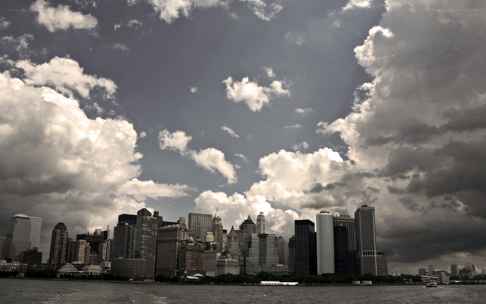Manhattan skyline under cloudy sky