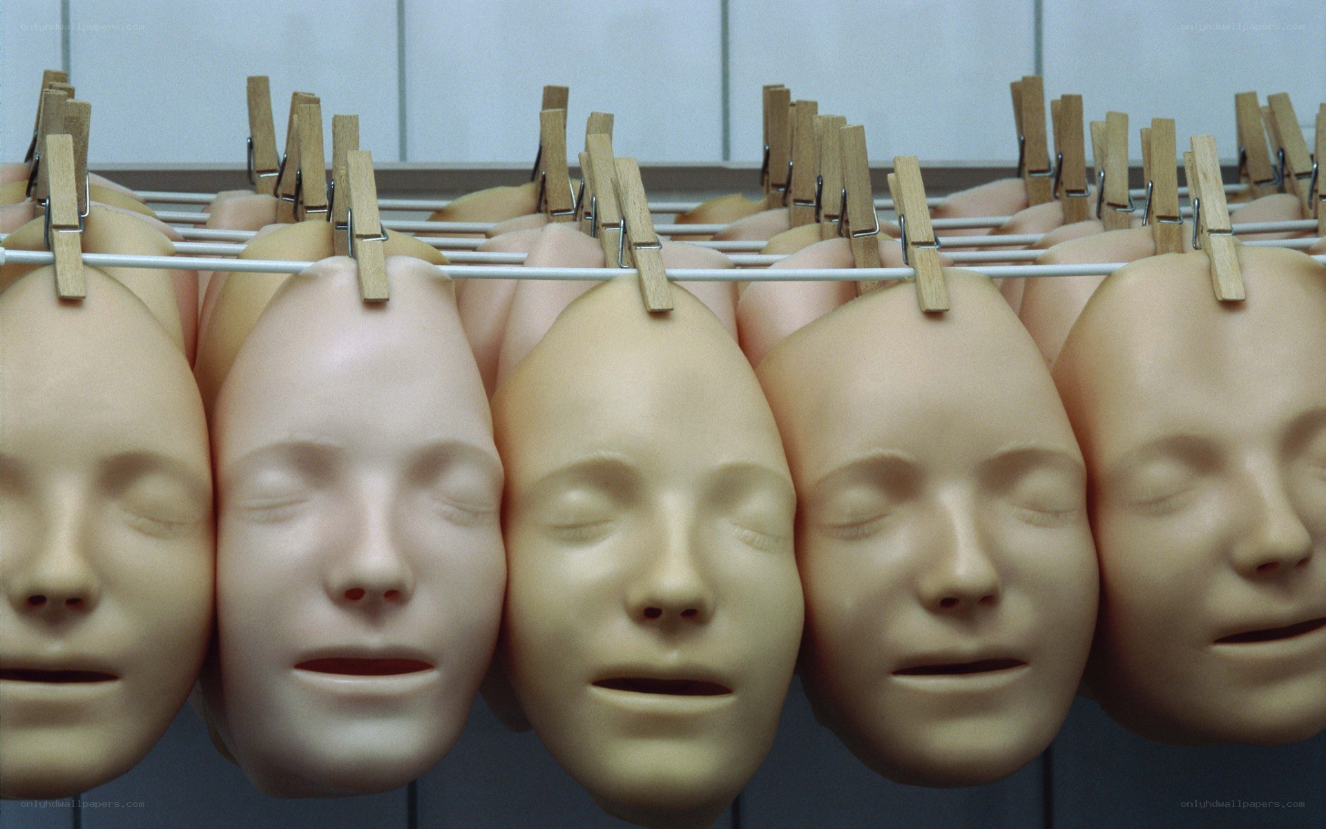 Mannequin heads on clothesline