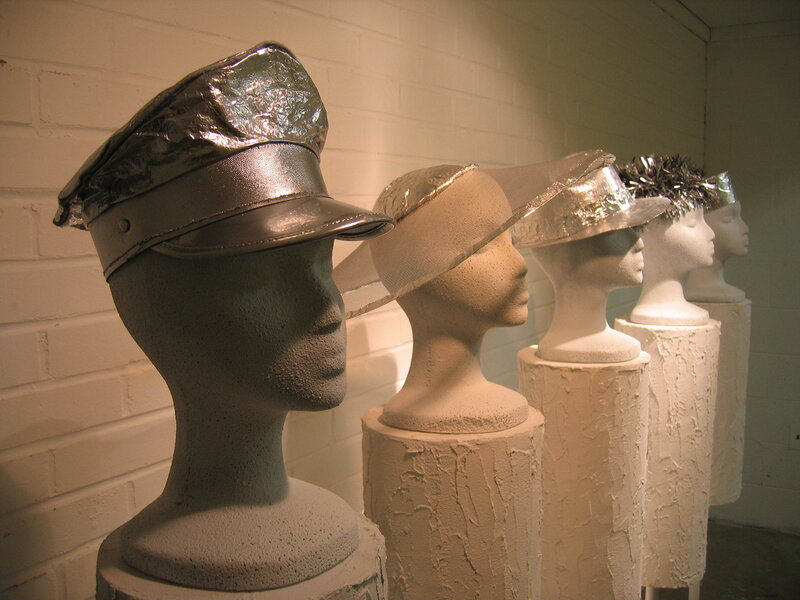 Mannequins with metallic hats