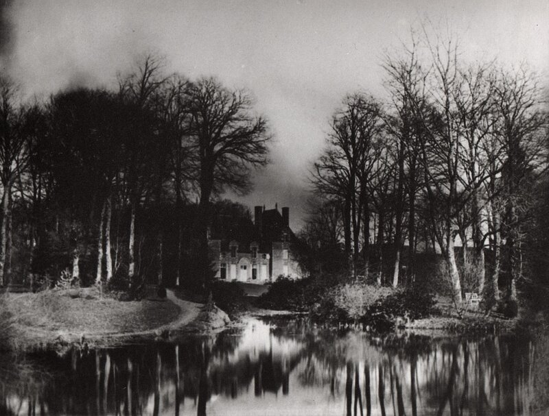 Manor house by a pond
