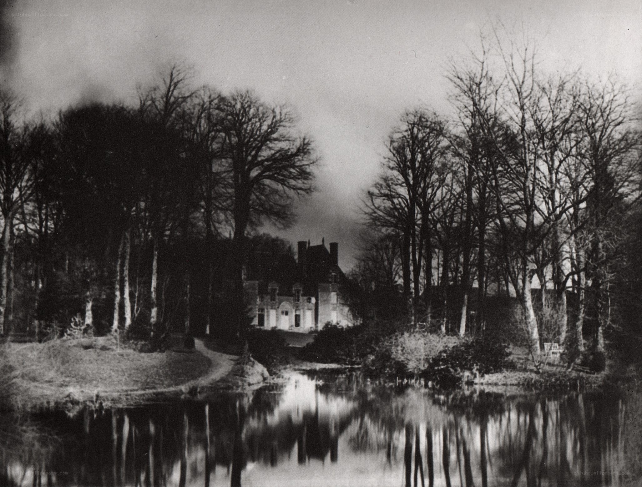 Manor house by a pond