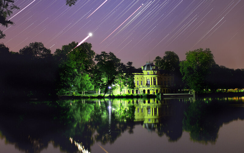 Mansion by Lake at Night