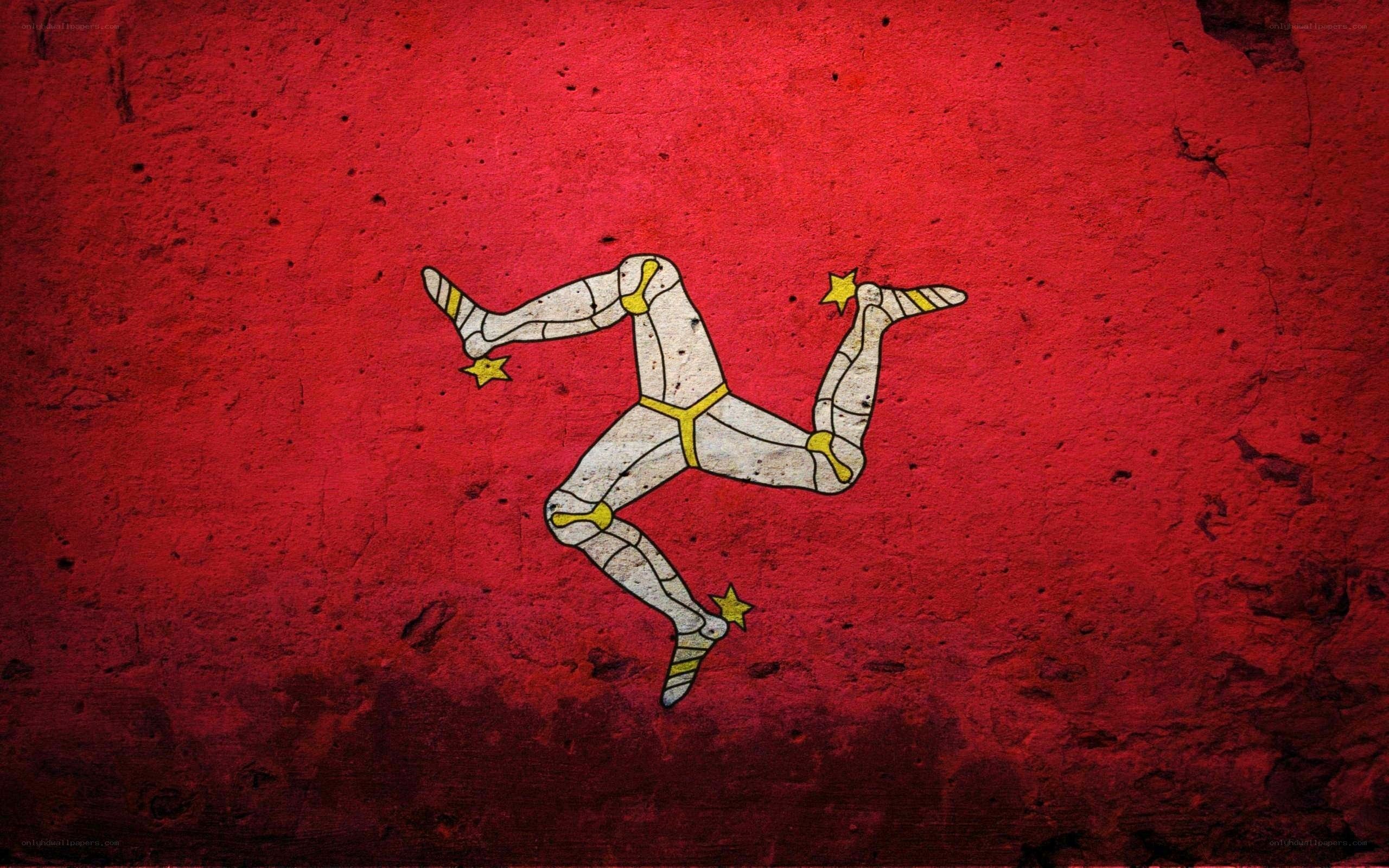 Manx flag on red wall