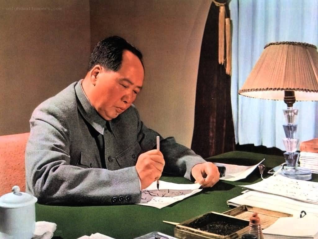 Mao Zedong writing at desk