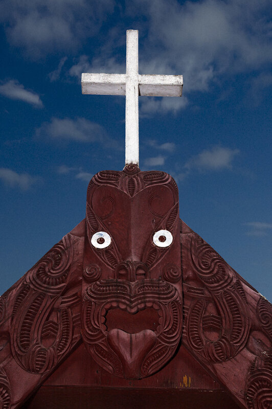 Maori carving with Christian cross