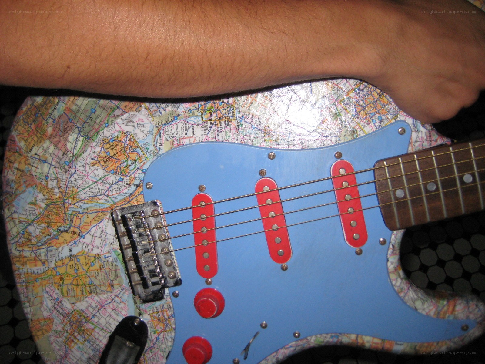 map-decorated electric guitar