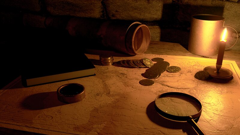 Map with Coins and Magnifying Glass
