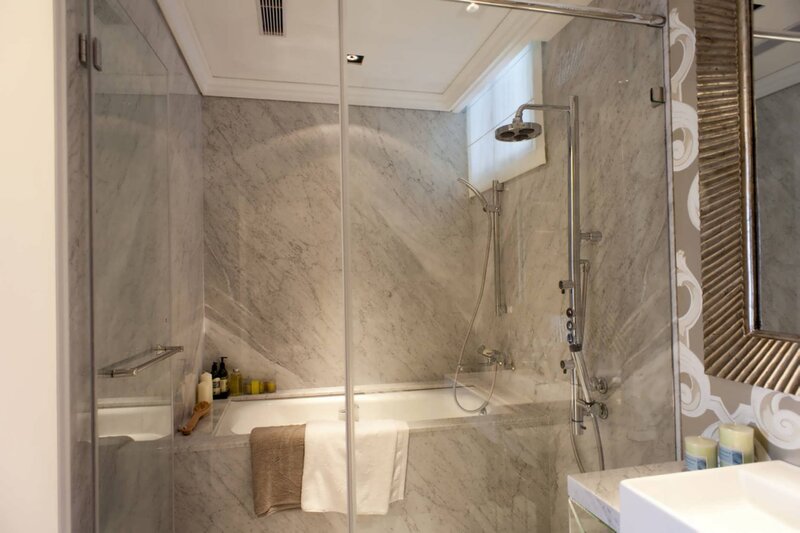 Marble bathroom with shower and tub