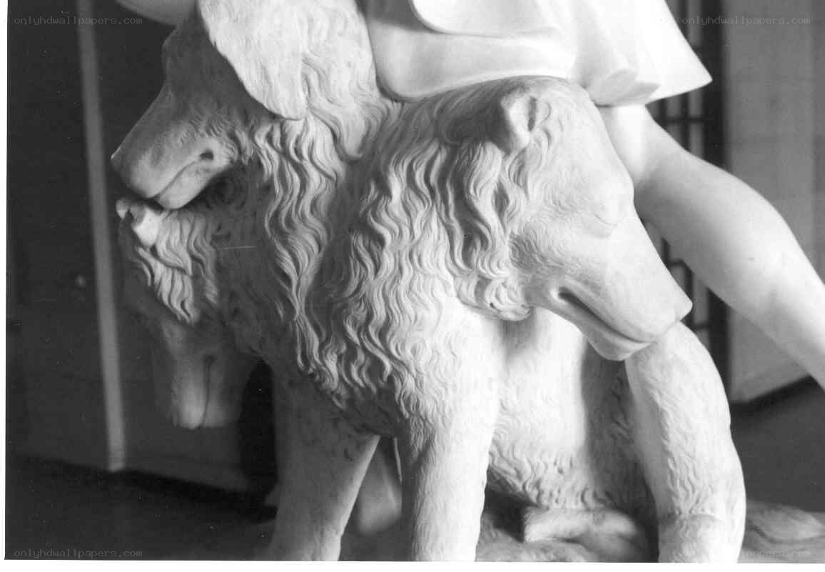 marble sculpture of two wolves