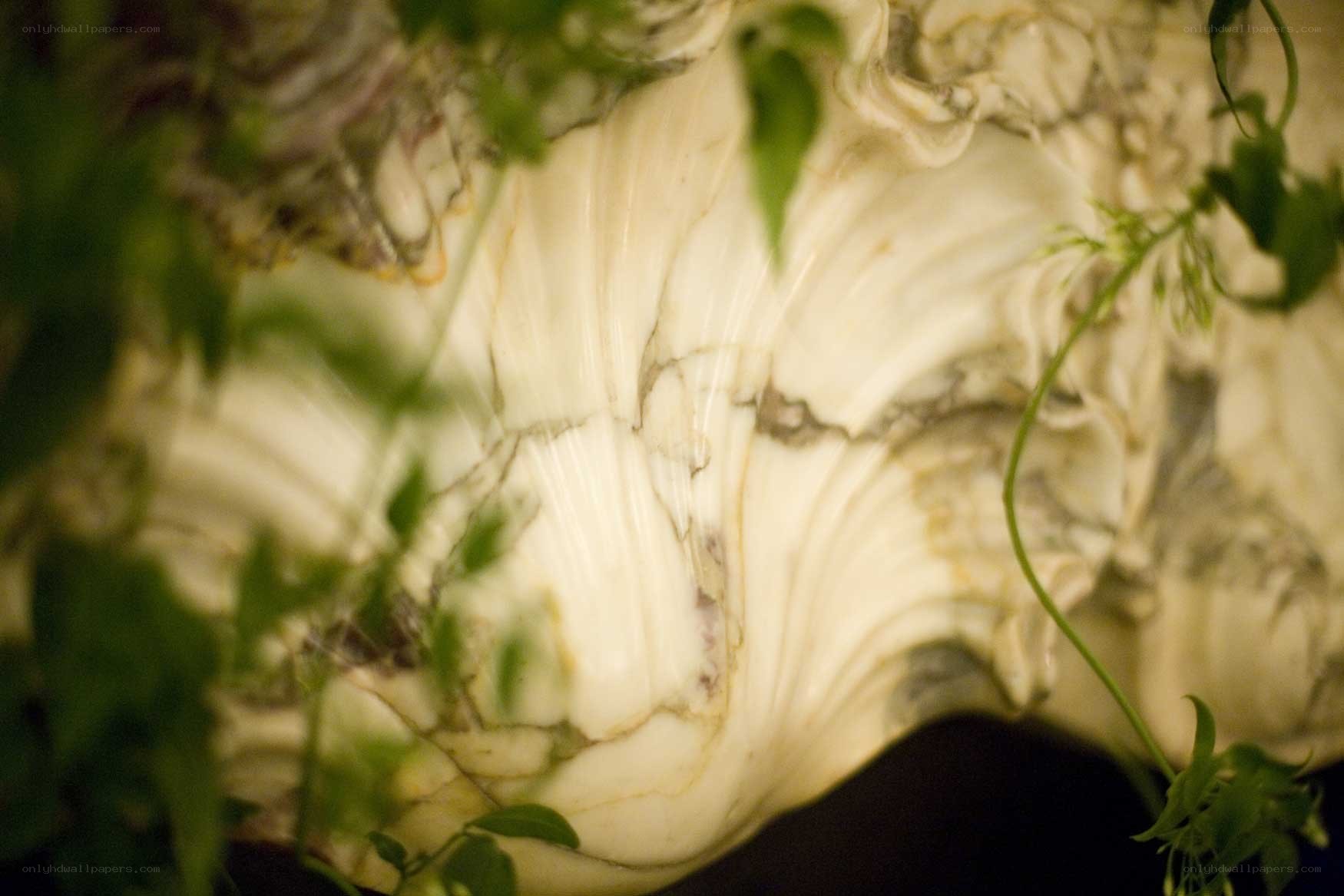 Marble sculpture with greenery