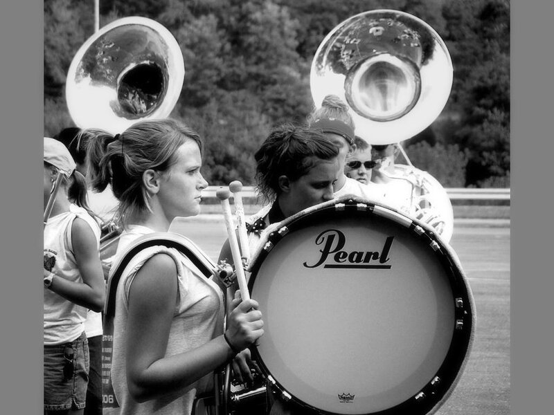 Marching band members performing