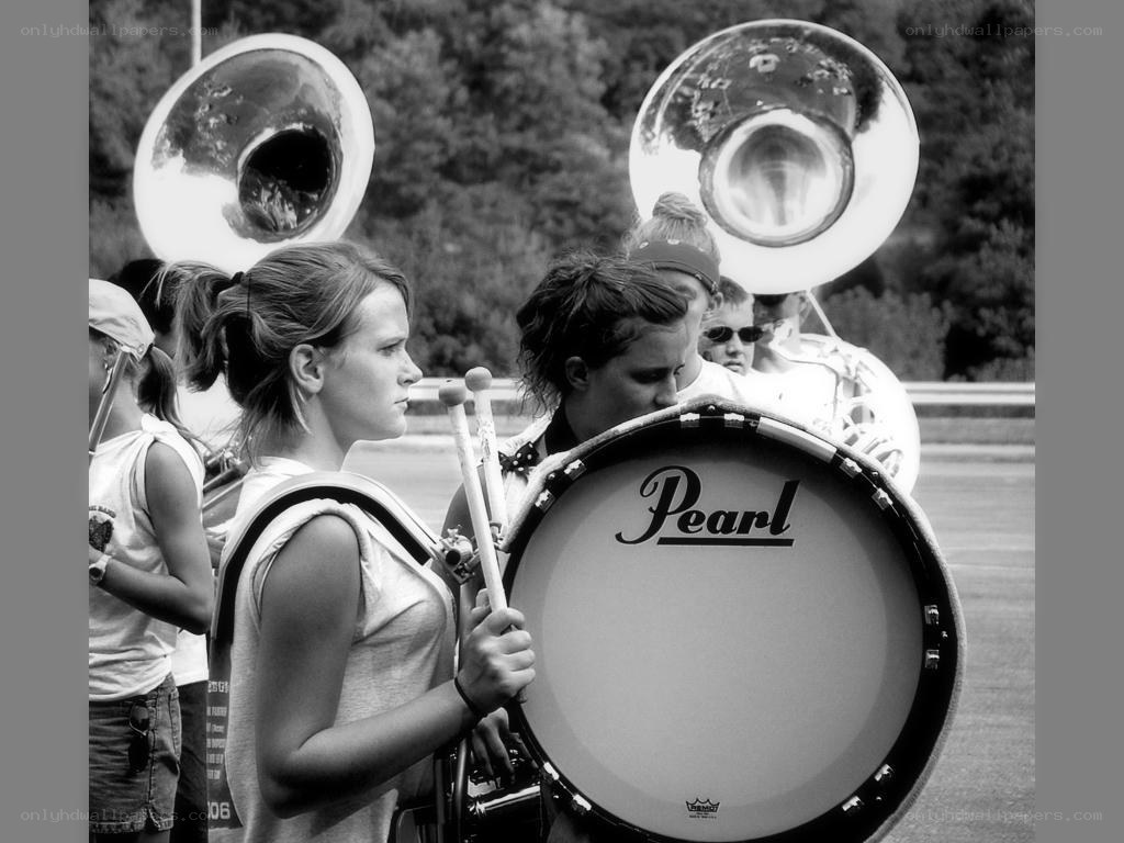 Marching band members performing