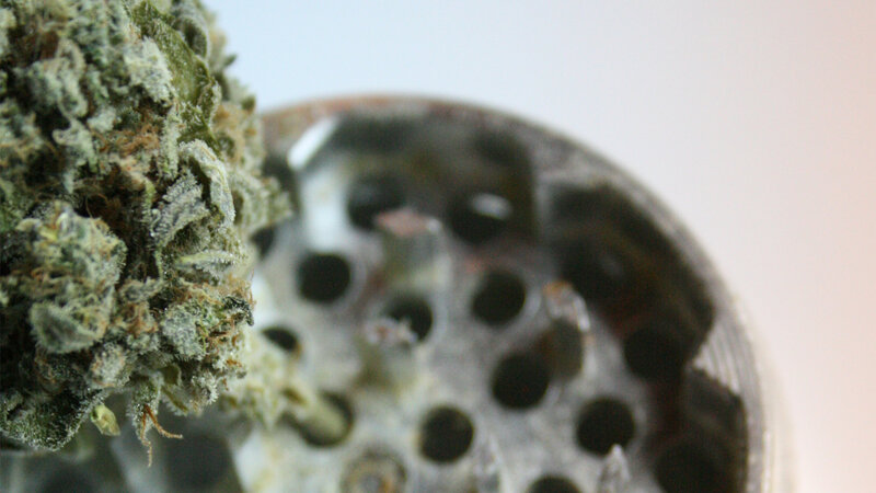 marijuana bud and grinder