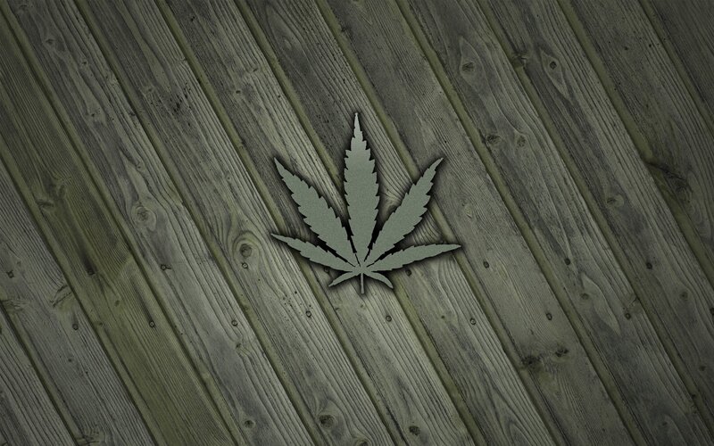 marijuana leaf on wood