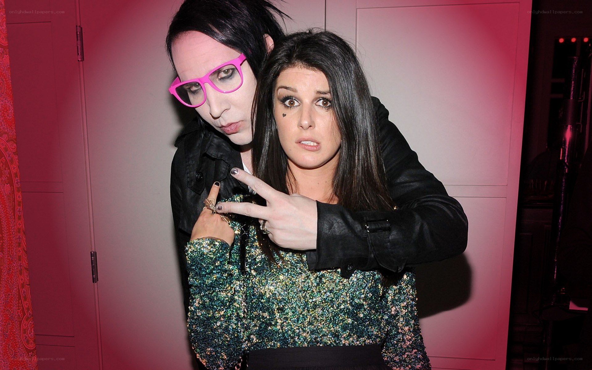 Marilyn Manson and a woman posing