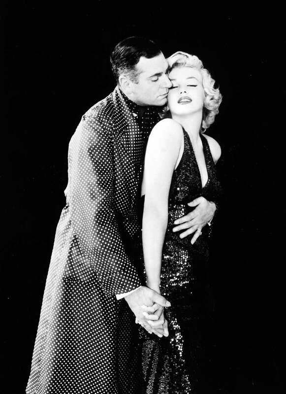 Marilyn Monroe and a man in formal wear
