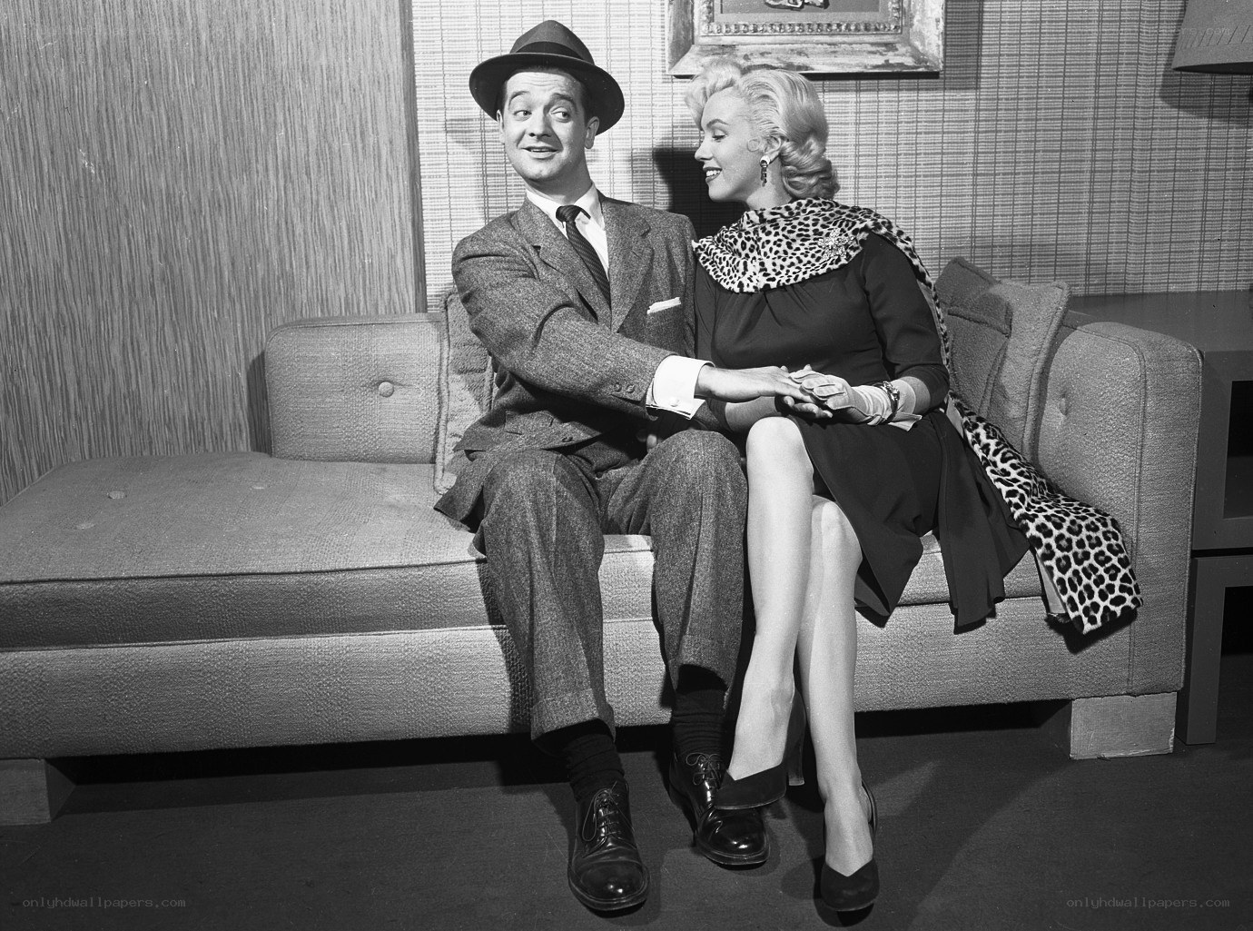 Marilyn Monroe and a man on a couch