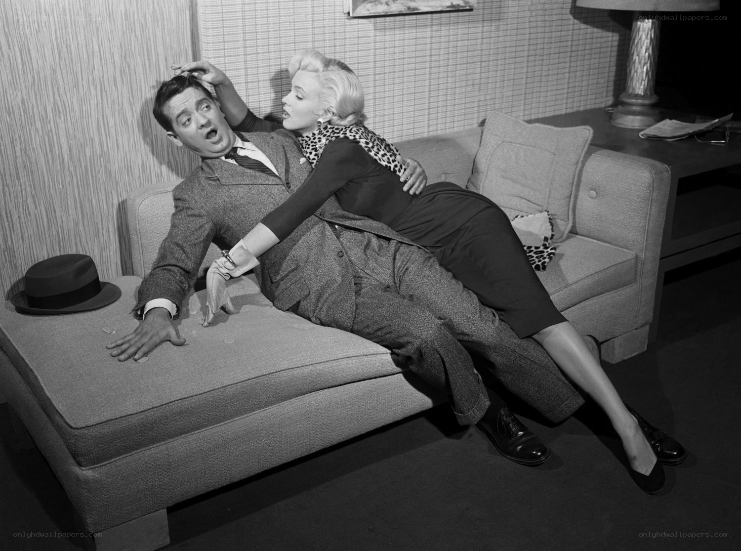 Marilyn Monroe and a man on a couch