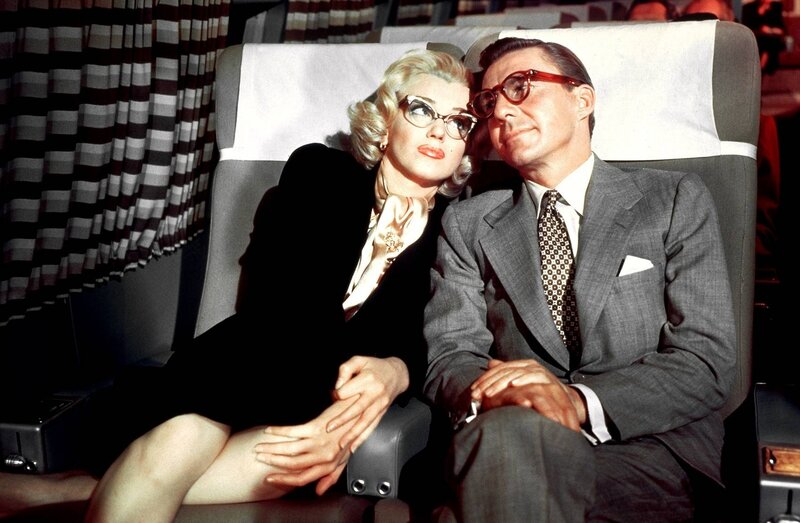 Marilyn Monroe and a man on an airplane