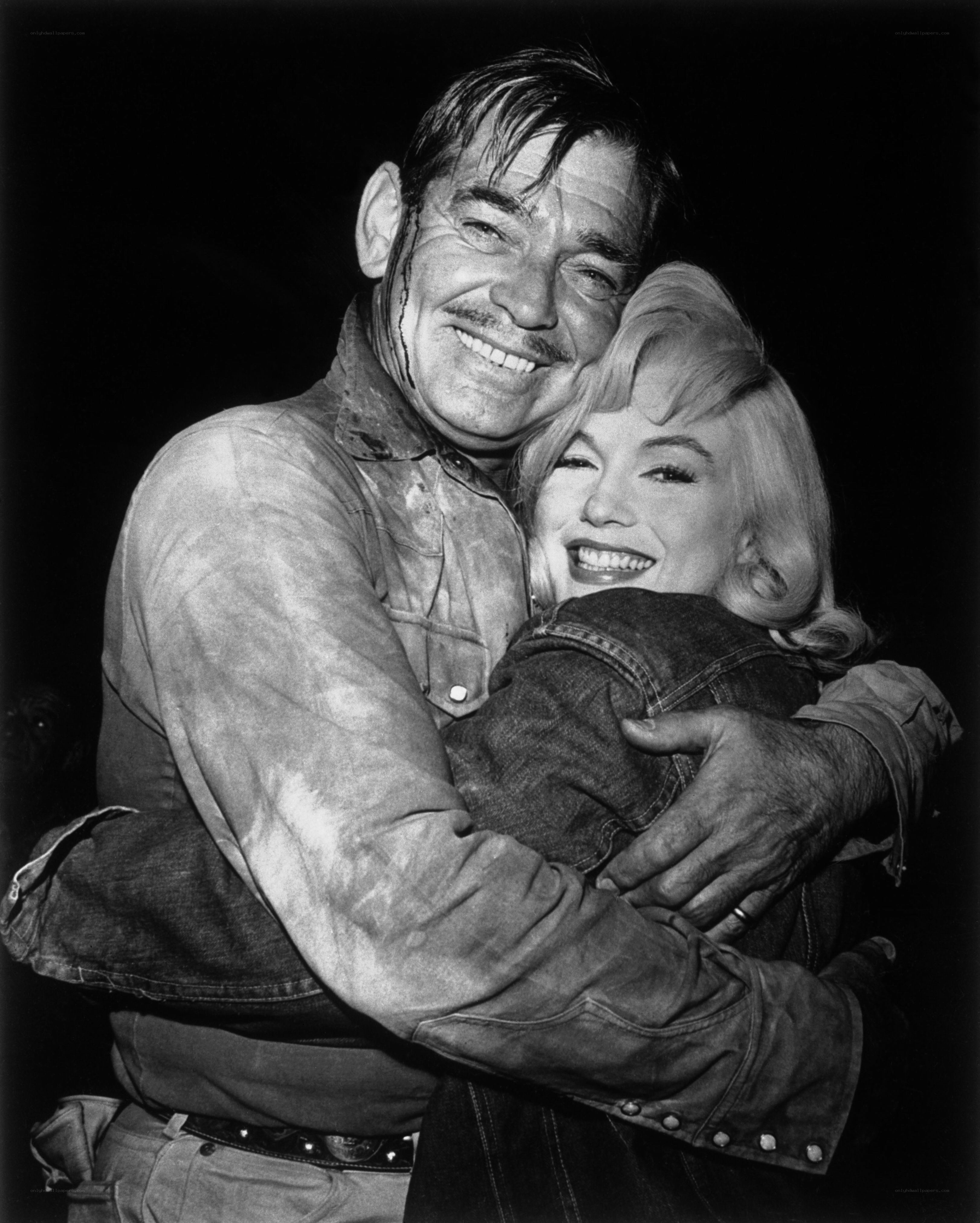 Marilyn Monroe and Clark Gable embrace